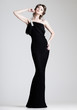 beautiful woman model posing in elegant dress in the studio