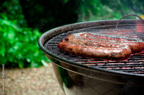 Photo: Tradtional South African braai barbecue borewors sausage on fire Tradtional South African braai barbecue borewors sausage on fire