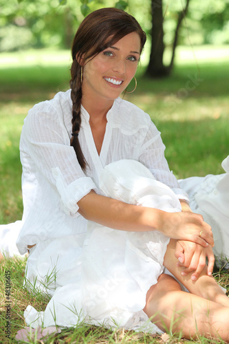 Photo: portrait of a woman on the grass portrait of a woman on the grass