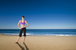 Athletic woman in the beach