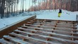 Snowboarder sliding the rail