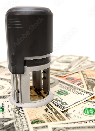 Photo: Stamp on dollars. Stamp on dollars.