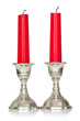Two red candles on white background
