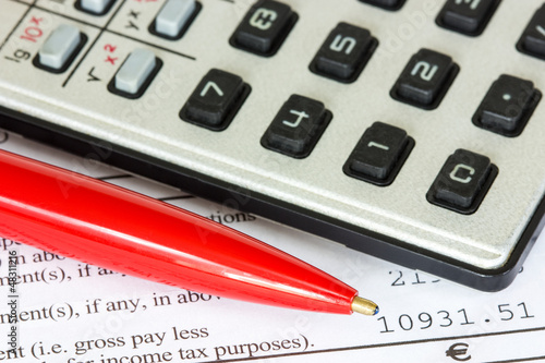 Photo: Tax or taxes concept Tax or taxes concept