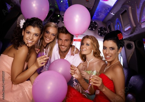 Photo: Young people having party in limo Young people having party in limo