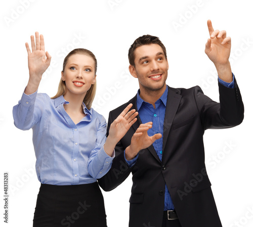 Photo: man and woman working with something imaginary man and woman working with something imaginary