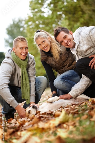 Photo: Happy companionship stroking dog Happy companionship stroking dog