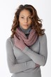 Beautiful ethnic woman in scarf and gloves