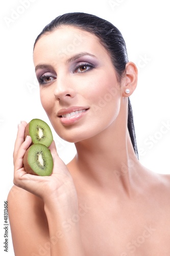 Photo: Portrait of healthy fresh woman with kiwifruit Portrait of healthy fresh woman with kiwifruit