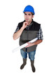 Architect holding rolled-up plans