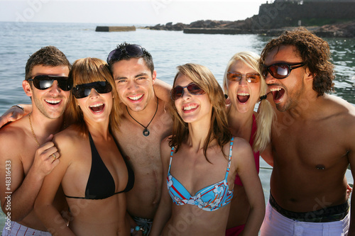 Photo: Group of friends at the beach Group of friends at the beach
