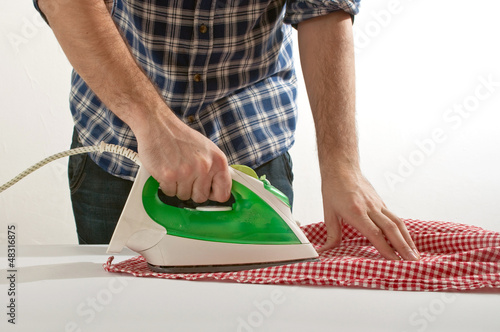 Photo: Man ironing Man ironing