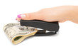 Stapler, dollars and a female hand. On a white background.
