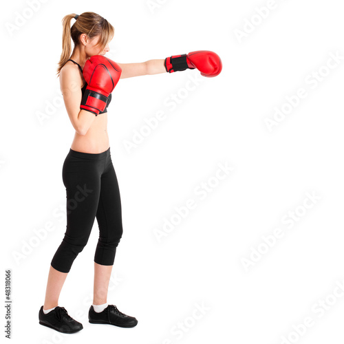 Photo: Young woman wearing boxe gloves isolated on white Young woman wearing boxe gloves isolated on white