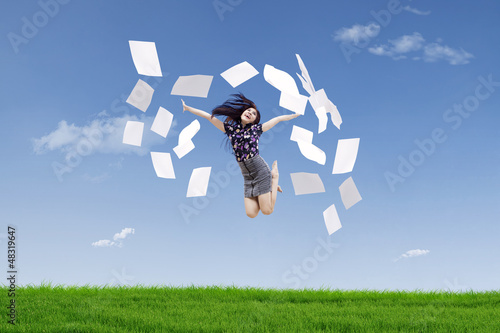 Photo: Happy businesswoman throw papers Happy businesswoman throw papers