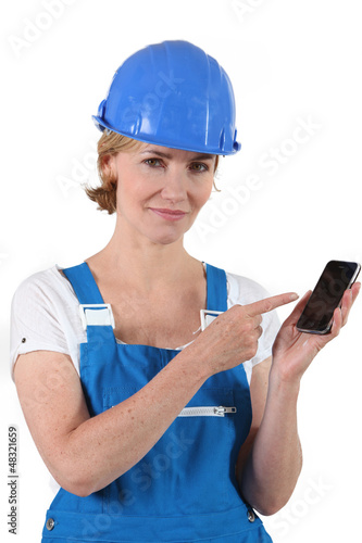 Photo: portrait of a woman in working clothes portrait of a woman in working clothes