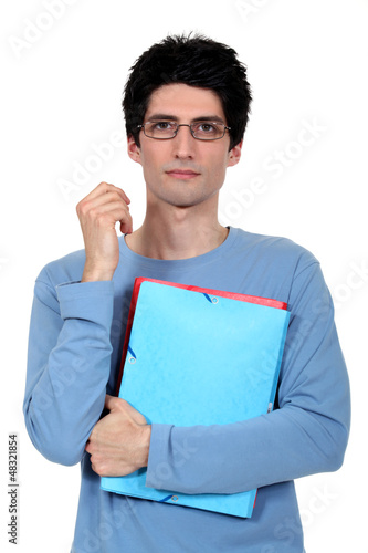 Photo: Student holding files Student holding files