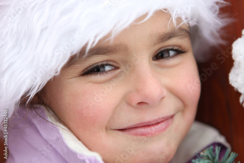 Photo: Portrait of a cute little girl by wintertime Portrait of a cute little girl by wintertime