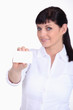 Woman displaying a business card
