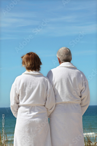 Photo: Middle-aged couple at the beach Middle-aged couple at the beach