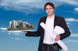 Engineer holding a model of a city
