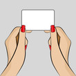 Womans hand holding a business card