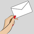 Womans hand holding an envelope