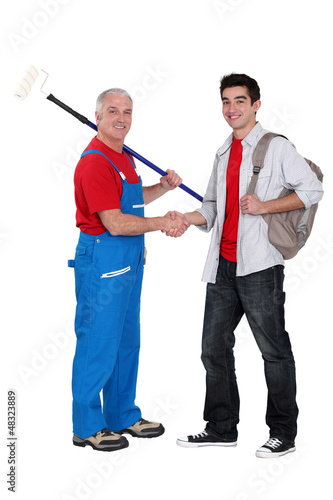 Photo: Decorator welcoming young starter Decorator welcoming young starter