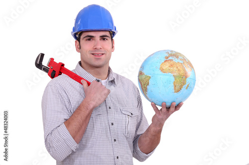 Photo: Plumber with a globe Plumber with a globe