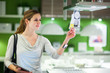 Young woman shopping for furniture in a furniture store