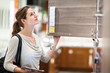 Young woman shopping for furniture in a furniture store