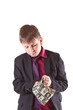 boy looking for money in the bag