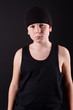 boy in a black T-shirt and a black hat