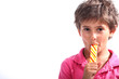 Boy sucking on a lollipop