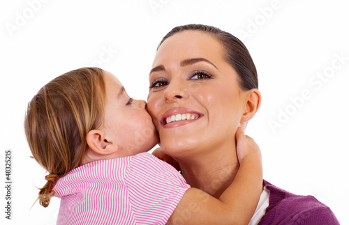 Photo: little daughter kissing mother isolated on white little daughter kissing mother isolated on white
