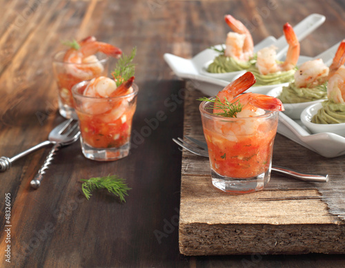 Photo: Tomato salsa with shrimp and Avocado cream and shrimp in spoon Tomato salsa with shrimp and Avocado cream and shrimp in spoon