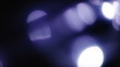 Blue defocused lights bokeh. Moving blue bokeh background.