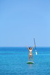 Aspirational beach lifestyle woman on paddleboard
