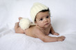 Photo: Newborn baby wearing a white hat Newborn baby wearing a white hat