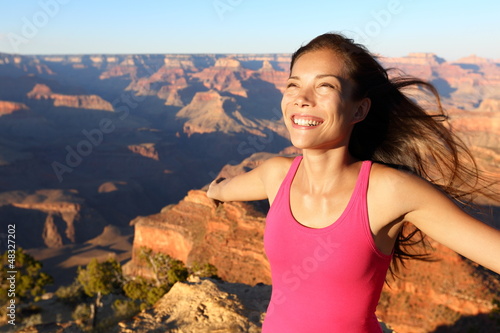 Photo: Happy freedom woman in Grand Canyon Happy freedom woman in Grand Canyon