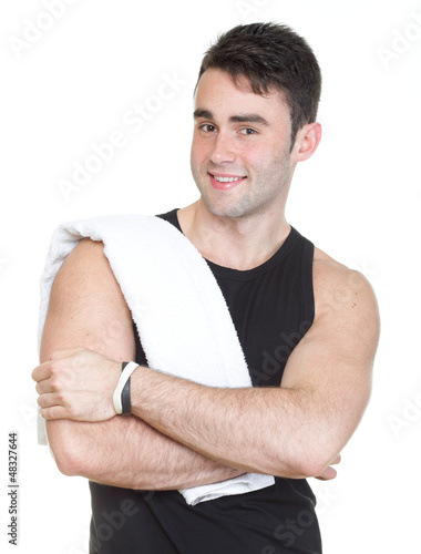Photo: Healthy young man with towel isolated Healthy young man with towel isolated