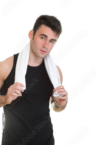 Photo: Healthy young man with towel isolated Healthy young man with towel isolated