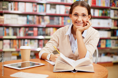 Photo: Young girl in library Young girl in library