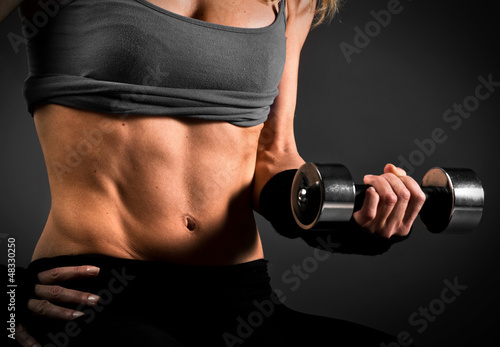 Photo: Fit woman abdomen muscle definition Fit woman abdomen muscle definition