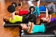 Photo : weight training in the gym with dumbbells weight training in the gym with dumbbells