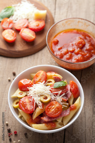 Photo: pasta with tomatoes and salami pasta with tomatoes and salami