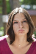 Foto: young woman bored of being outdoors young woman bored of being outdoors