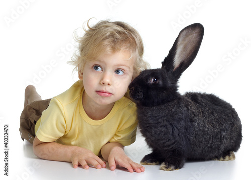Photo: blond girl and black rabbit blond girl and black rabbit