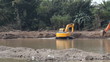 Backhoe digging wells