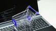 Online Shopping. Shopping cart on a keyboard.